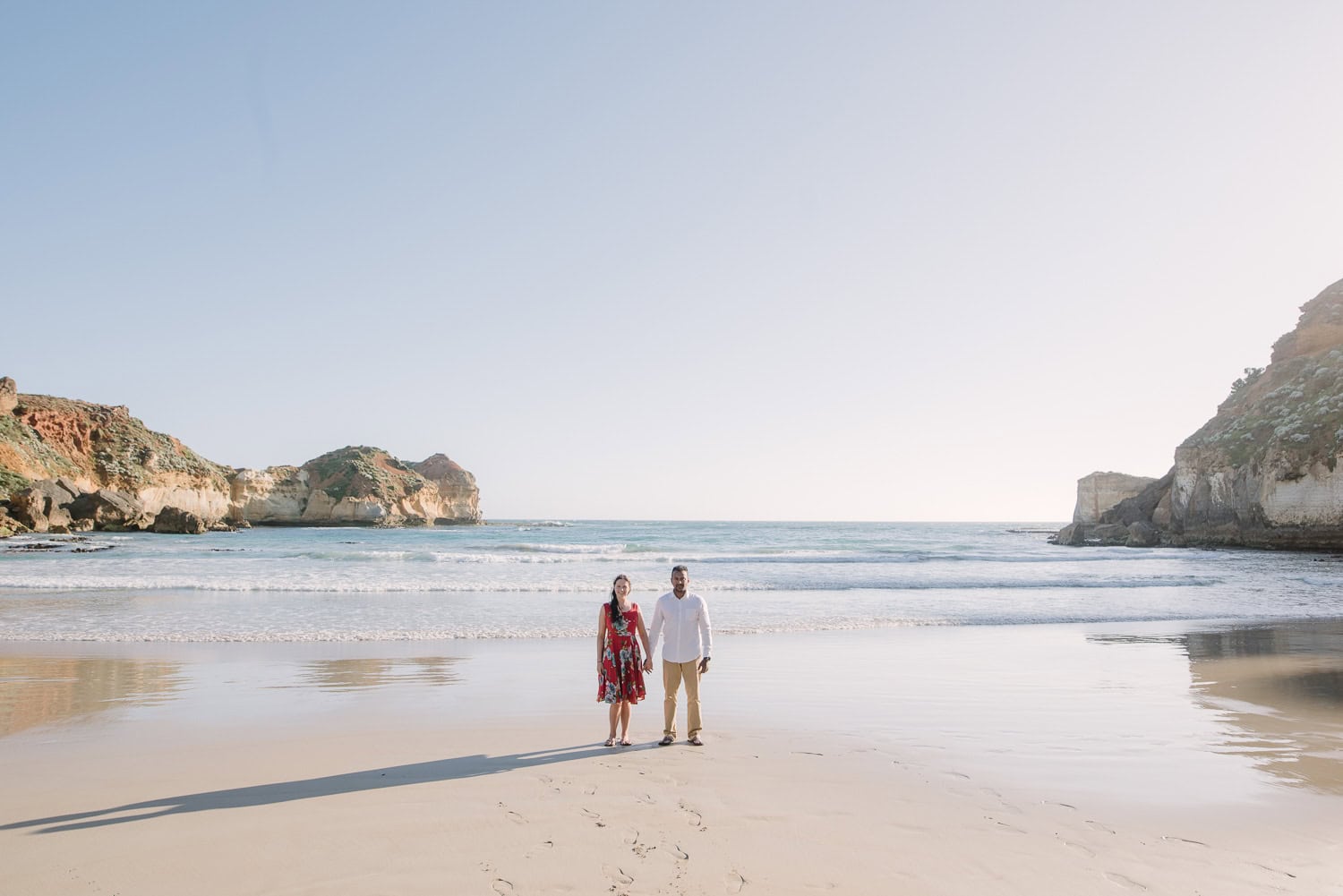 Lovers stood on the beach at Childers Cove in Victoria